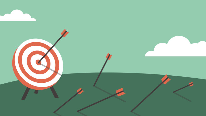 An illustration of an archery target. Five arrows have hit the ground, but one arrow has hit the target dead center.